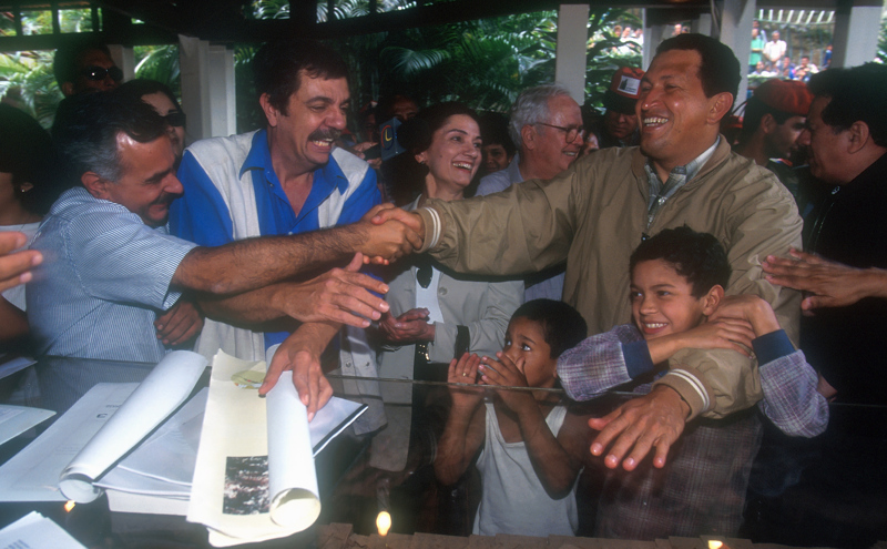 Hugo Chavez greets people in Caracas