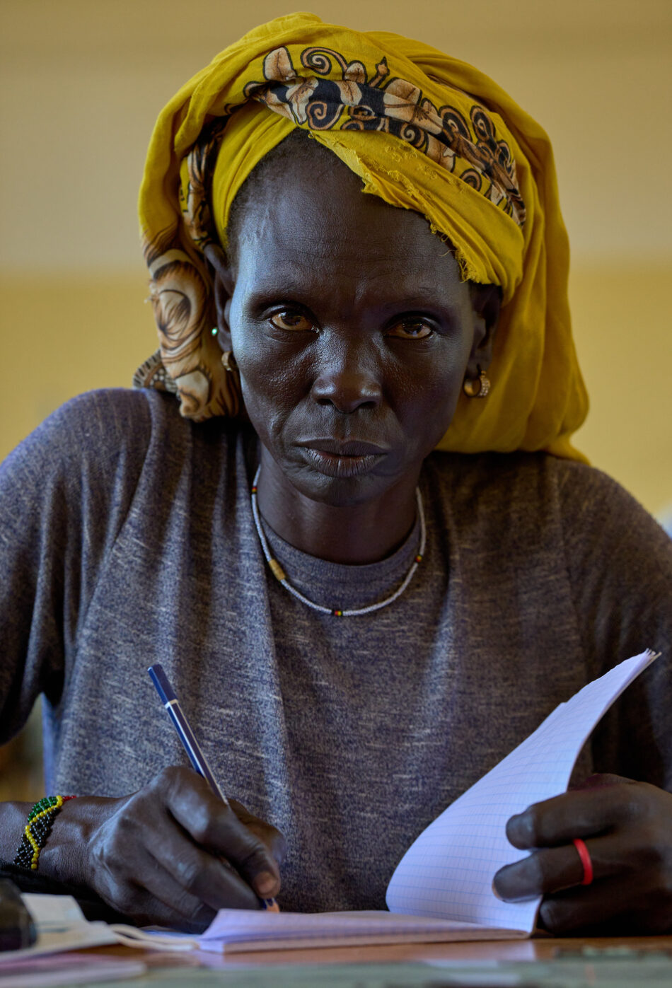 Mary Aping Ghor participates in an adult literacy class at the Loreto Primary School in Rumbek, South Sudan.
